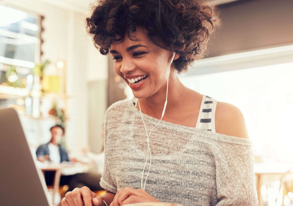 woman smiling on laptop