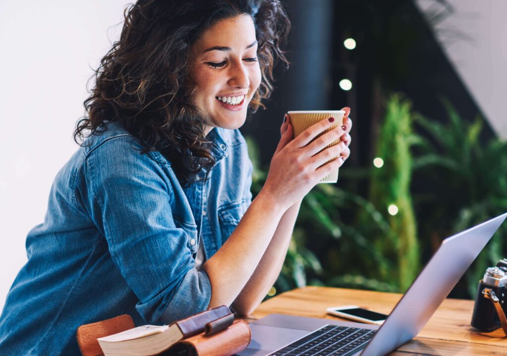woman smiling at laptop